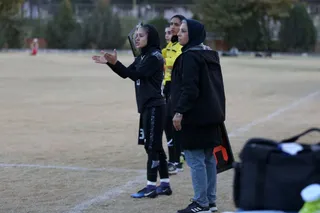 تام